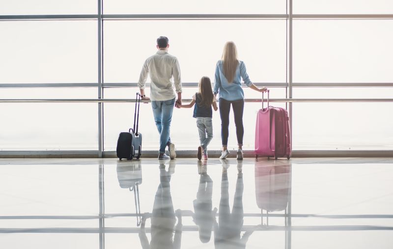A young family at the airport, ready to travel