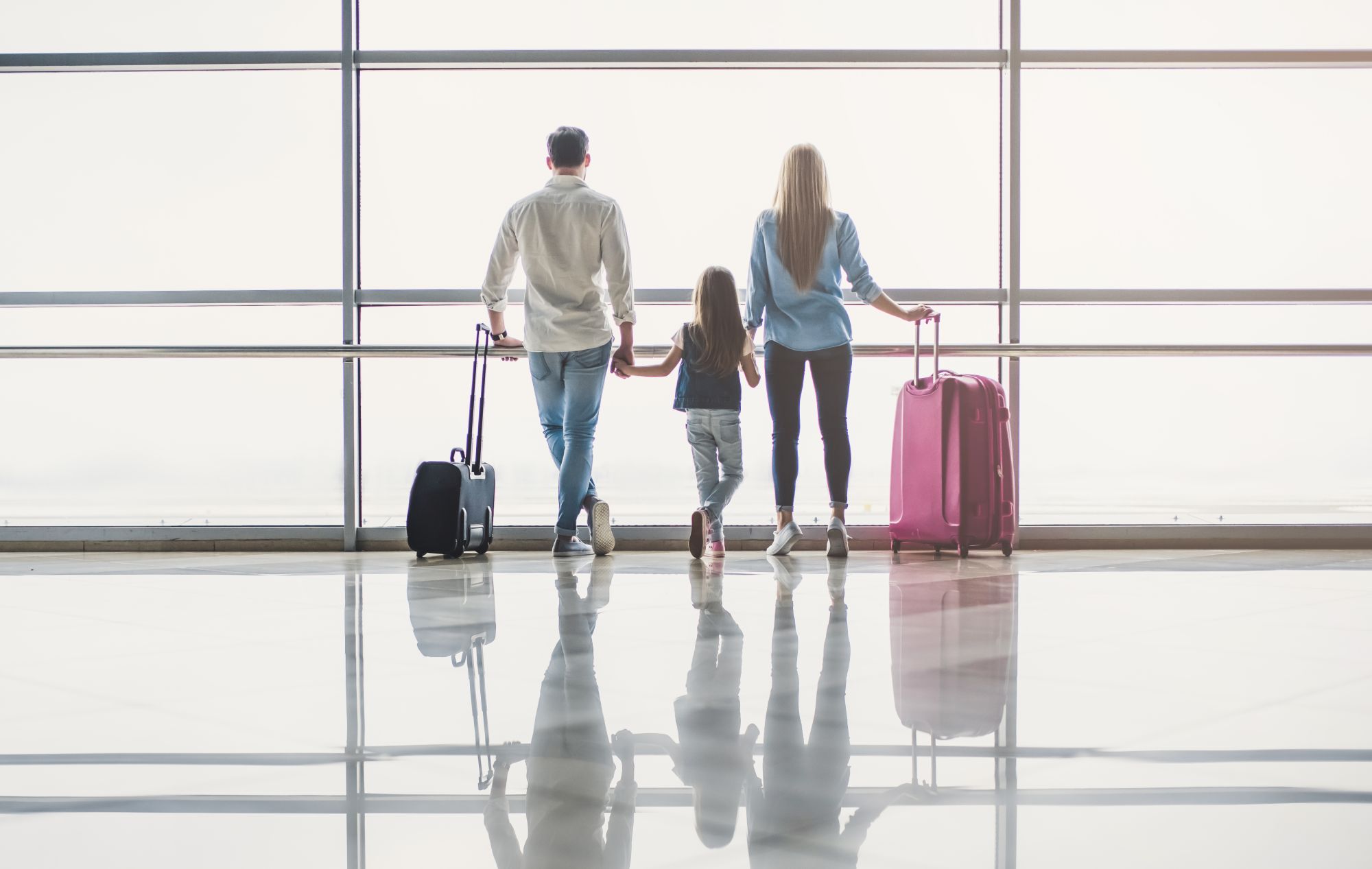 A young family at the airport, ready to travel